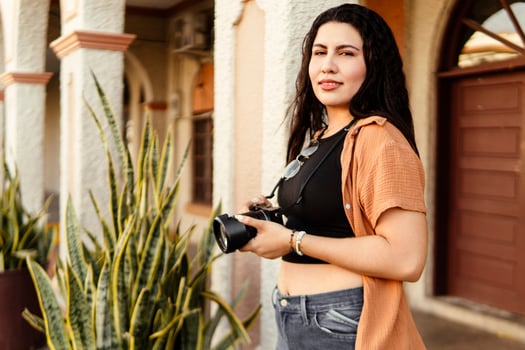 Photographer exploring local culture during travel photography session photo