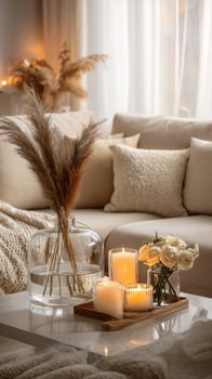 Cozy Living Room With Candles and Decorative Plants During Evening Light. photo