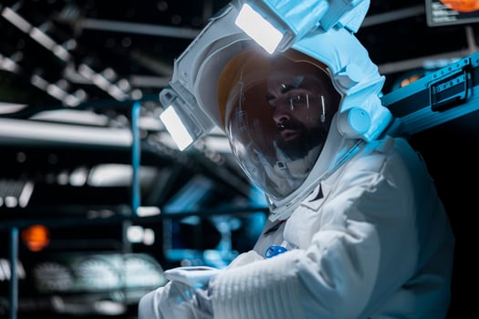 Injured space station crew member calling for backup, contacting ground control. Astronaut pressing wrist touchscreen display to send SOS message to mission command center on Earth photo