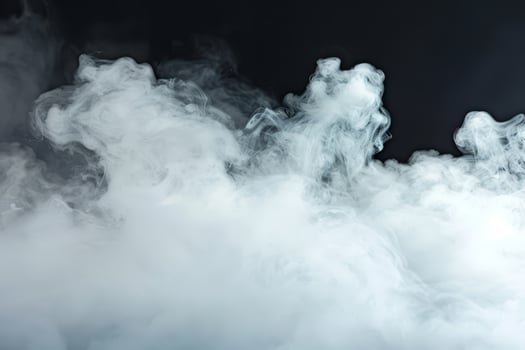 Delicate tendrils of white smoke rise and curl against a dark background, evoking mystery and intrigue in a dynamic display of movement photo