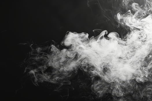 Tendrils of white smoke rise, twisting and curling in the dark, forming ethereal shapes that evoke a sense of mystique and allure photo