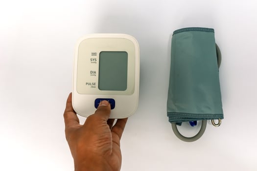Checking Blood Pressure with a Digital Monitor for Health and Wellness Management photo