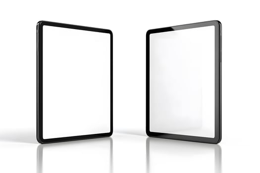 Two Black Tablets with Blank Screens and Reflections on White Su photo
