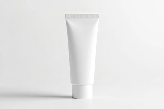 Minimalist white cosmetic tube mockup on a clean white background with subtle shadows photo