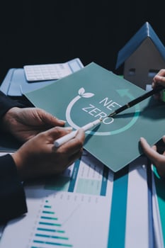 Business people holding paper with the word zero on it photo