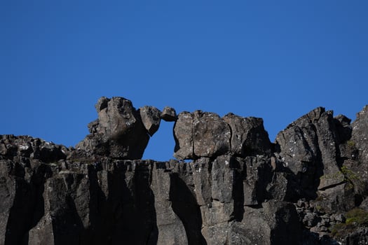 Unique Natural Rock Formation Under Clear Blue Sky in Daylight photo