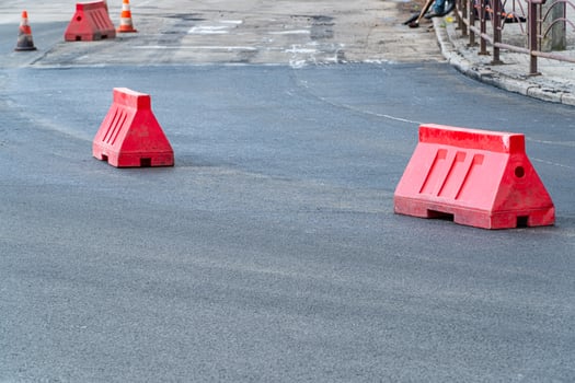 New asphalt road. Plastic road fencing photo