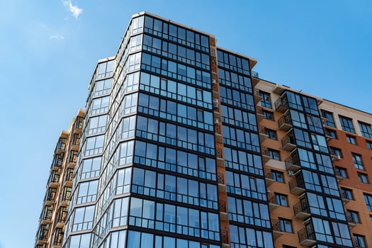 Modern Luxury Apartment Building. Facade of a modern apartment building. Blue sky on the background photo