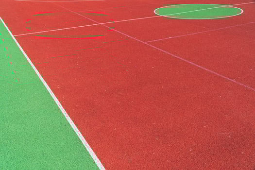 Basketball court closeup. Colorful basketball lines on an outdoor court photo