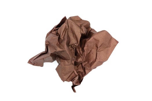 Brown crumpled paper isolated on white background photo