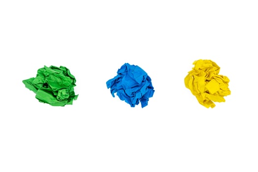 Three colorful crumpled paper balls isolated on white photo