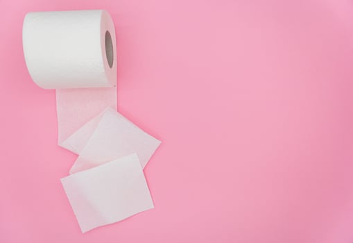 White roll of toilet paper on color background. Hygiene concept. Empty place for text or logo photo