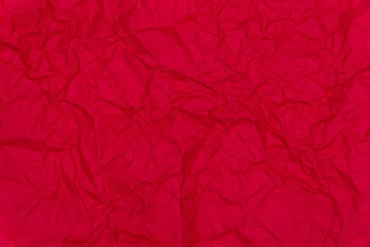 Red crumpled paper background. Crumpled red paper texture photo
