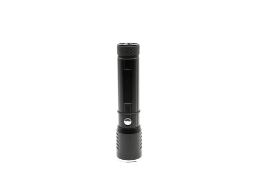 Black flashlight on white background photo