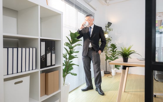Boss have coffee before meeting to check on progress of business project,297 photo