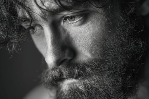 A man with a beard and a shirt photo