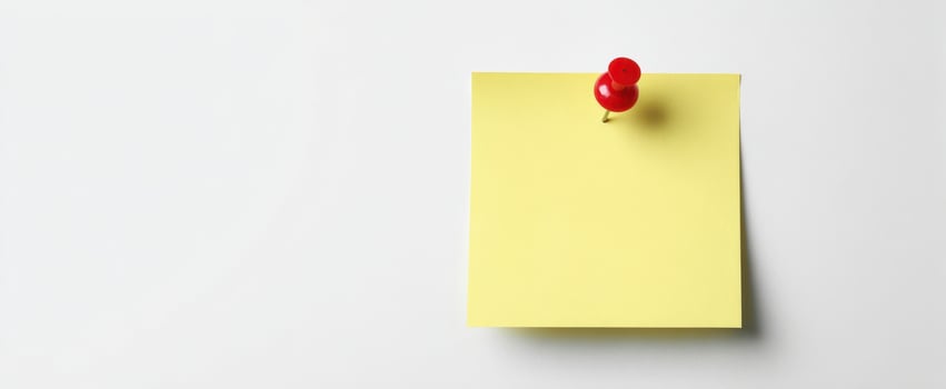 The yellow sticky note pinned to a clean surface for reminders and ideas. photo