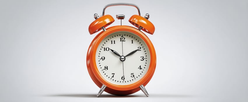 The vibrant orange alarm clock highlighting vintage charm and modern design. photo