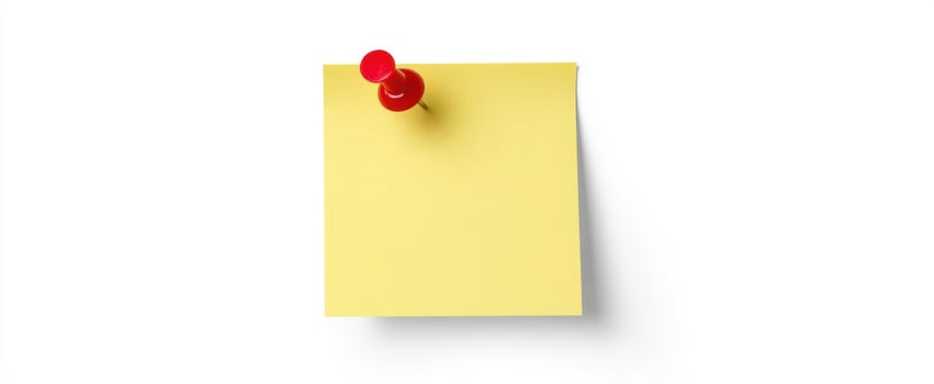 The bright yellow sticky note pinned with a red pushpin. photo