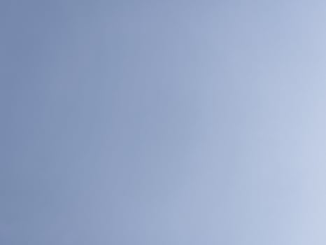 Clear Blue Sky A clear blue sky with minimal clouds, evoking a sense of calm and openness. photo