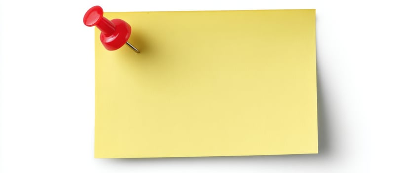 The yellow sticky note with a red pushpin attached for reminders photo