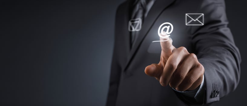 The businessman interacting with email icons in a digital context. photo