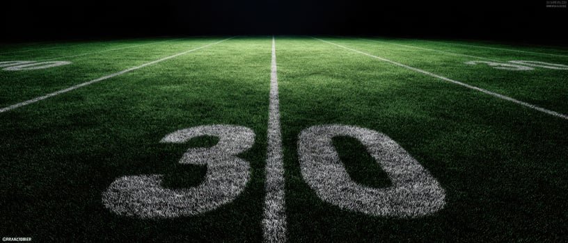 The 30 Yard Line on a Football Field at Night photo