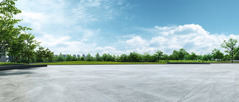 The expansive green park under a brilliant blue sky with fluffy clouds. photo