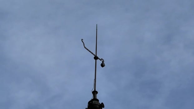 A striking rooftop tower with elegant slate tiles, ideal for capturing stunning architectural photography photo