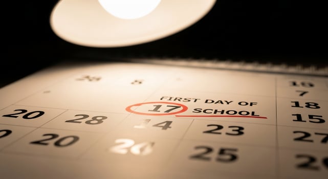 Calendar Marked for First Day of School on the Seventeenth with Red Circle photo