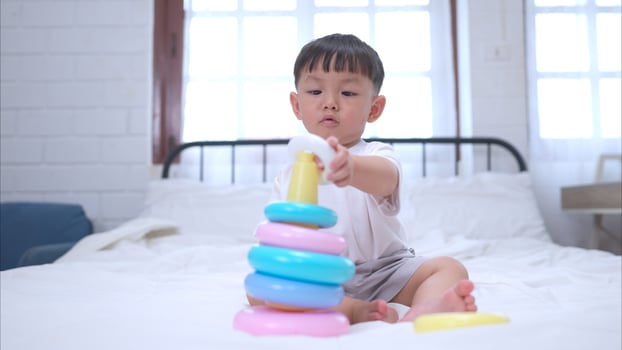 Before putting the kids to bed, kid unwind and play with toy in the bedroom,320 photo