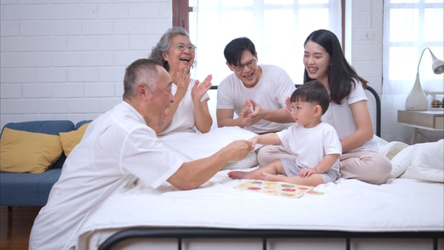 Before putting the kids to bed, parents, grandparents, and kid unwind and play,317 photo