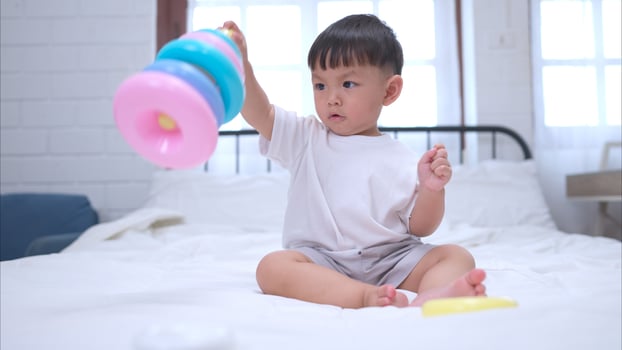 Before putting the kids to bed, kid unwind and play with toy in the bedroom,290 photo