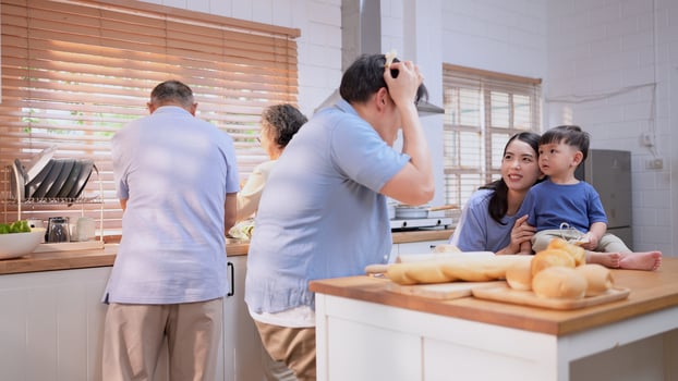 Happy Asian family preparing food together in a bright kitchen,227 photo