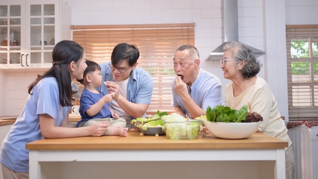 Happy Asian family preparing food together in a bright kitchen,224 photo