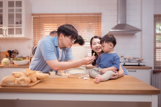 Happy Asian family preparing food together in a bright kitchen,61 photo