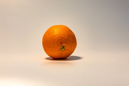 Vibrant Orange With Shadow Against Simple White Background photo