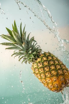 Pineapple with water splash, fresh fruit, refreshing, healthy eating. photo