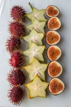 Vibrant Rambutan, Star Fruit, and Fig Arrangement photo