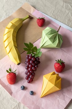 Origami Fruit Still Life, Banana, Grapes, Strawberries and Paper Gems photo