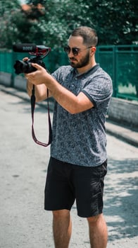 Man holding a camera photo