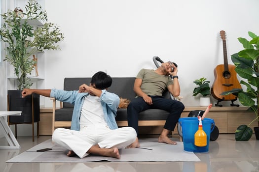 Couple Relaxing After Cleaning Together at Home. Sharing a moment of joy and satisfaction. photo