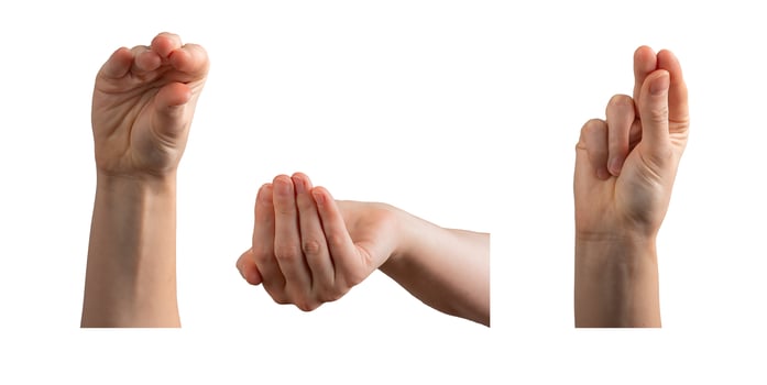 Hand gesture with fingers forming a religious sign, symbolizing the Holy Trinity. Woman s palm photo