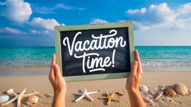 Hands Holding a Chalkboard Saying Vacation Time on a Beach photo
