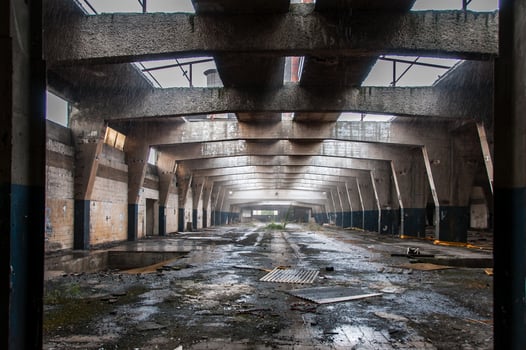 Inside ruined and abandoned large creepy industrial factory photo