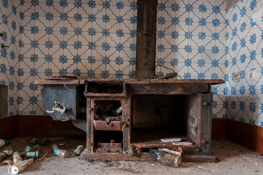 Detail of a very old stove in an abandoned mansion photo