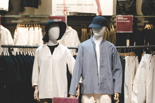Casual Clothing Display on Mannequins in Fashion Retail Store. Mannequins dressed in casual, minimalist outfits displayed in a modern fashion retail store. photo