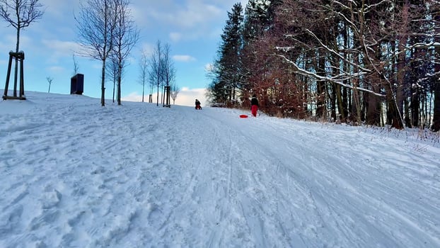 A stunning snowy hill perfect for sledding and various fun winter activities, offering endless enjoyment photo