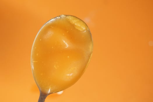 Ghee on a spoon top view photo