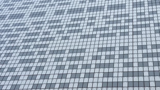 The stylish and striking facade of a modern building showcases a beautiful mosaic composed of gray and white tiles photo